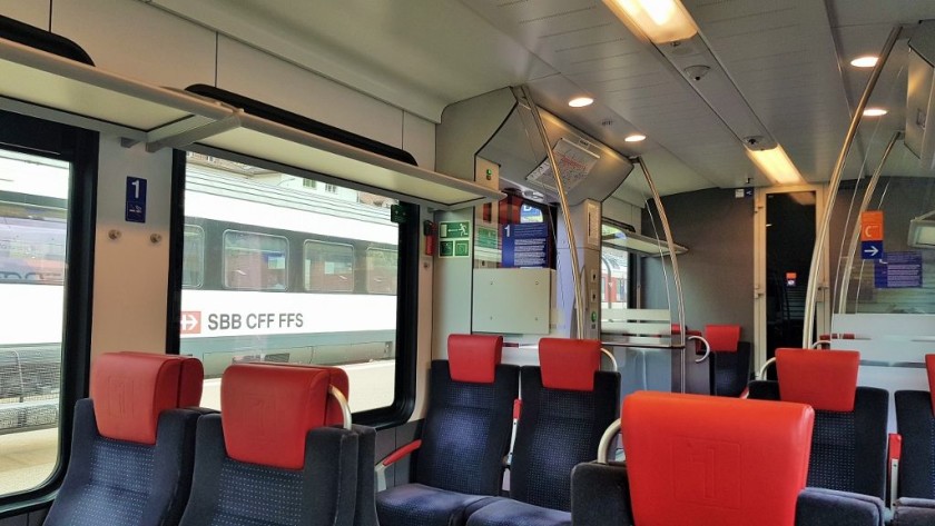 The 1st class interior of a single deck train being used on a RE service