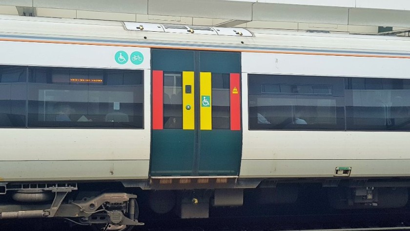 The signs indicating which doors are by the bike and wheelchair spaces