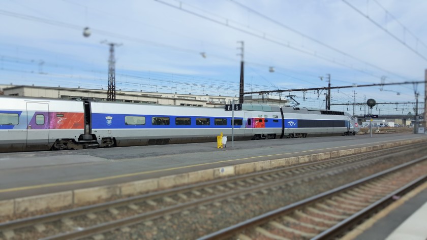 The red by the doors is an indicator of a Standard Class coach