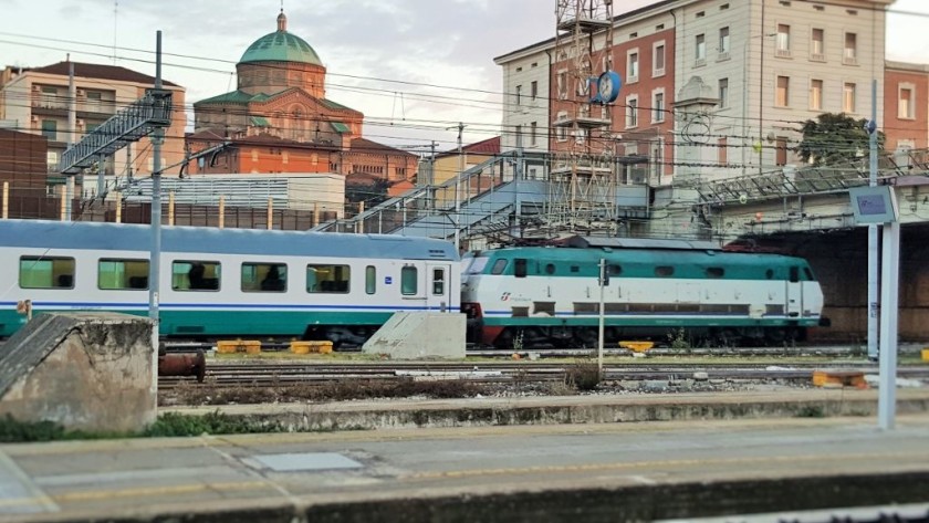 An Intercity train departs from Bologna