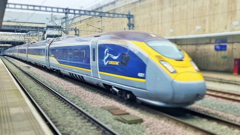 A Eurostar e320 train races through Stratford International station