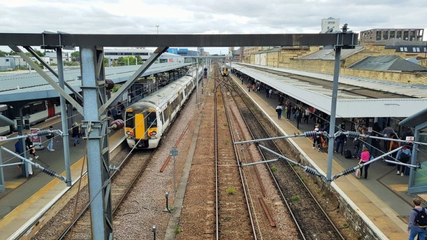 The train on the left is at platform 7 and the train in the right distance is at platform 1