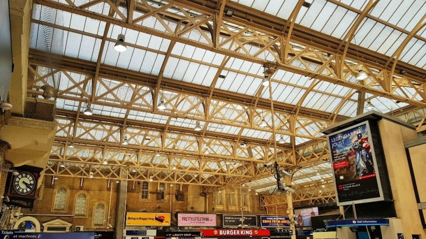 From inside the main entrance on to the right hand side of the concourse, the ticket desks are to the left and the trains are to the right