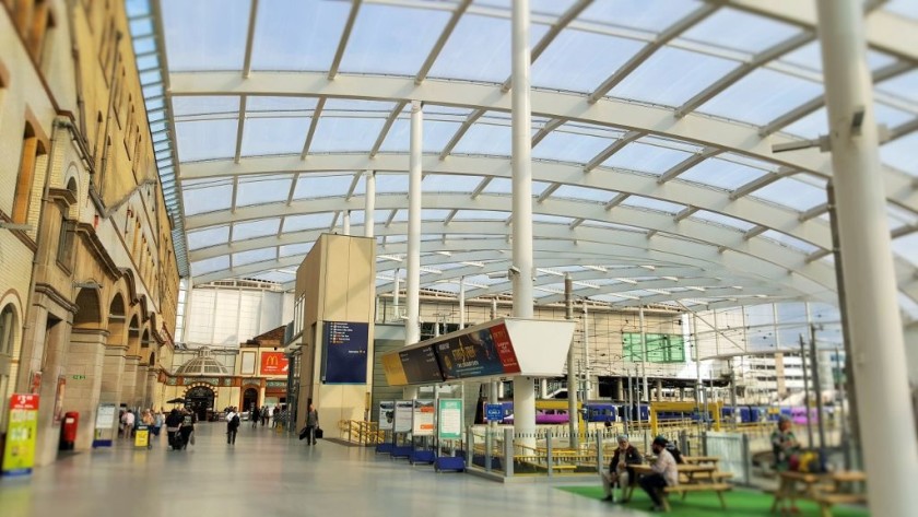 From the main entrance, ticket counters to the left, trains straight ahead, trams to the right