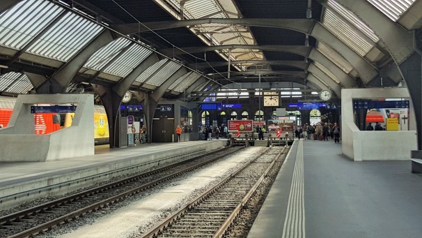 If you want to exit, access the trams, or use the elevators down to the lower, level walk ahead on to the main concourse