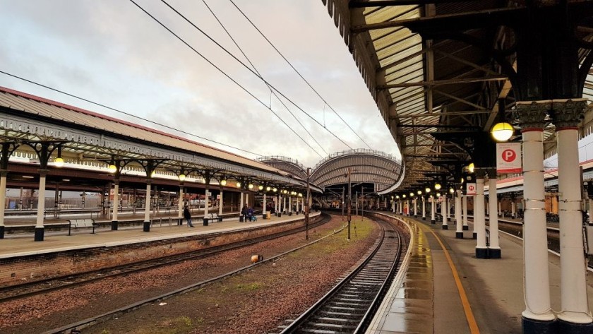 Note the signs on the posts to the right with coach info for the LNER trains