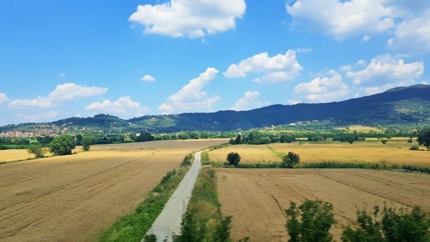 From the right there are distant views of the Apennine foothills