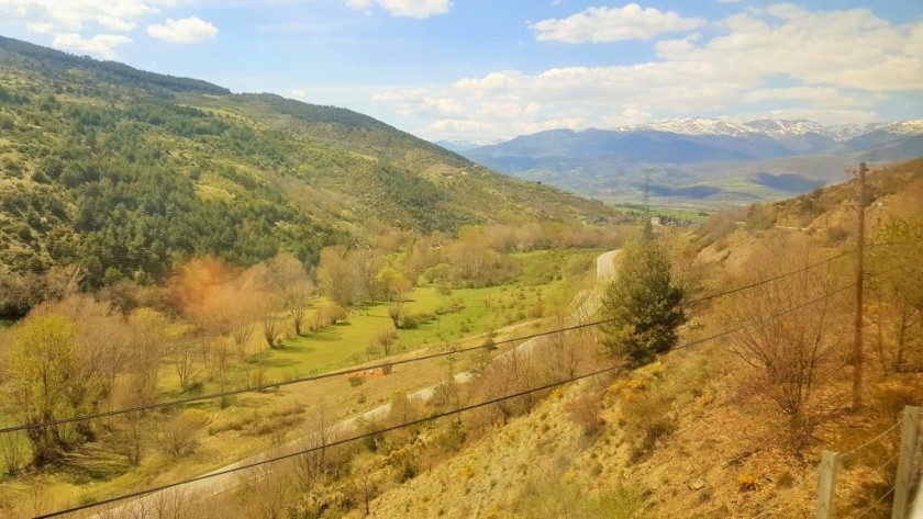 Towards journey's end the trains descend to the plain which houses the town of Puigcerida