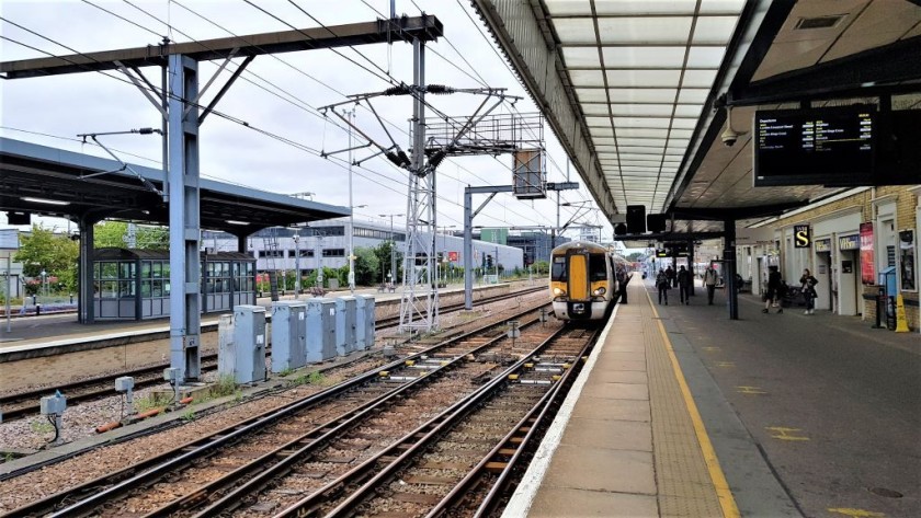 The train is at platform 1, beyond it and to the right are platforms 2 and 3.