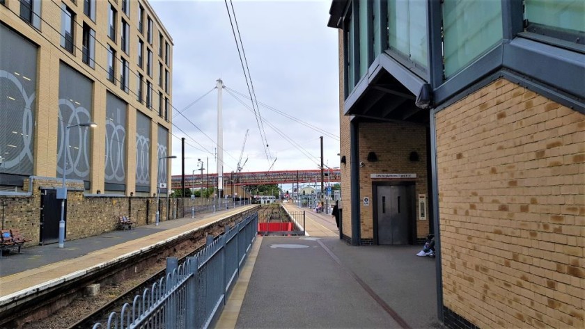 the lift to the footbridge is tucked behind the staircase