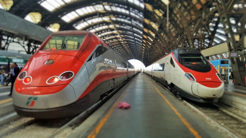 The train on the right has arrived in Milano from Geneve