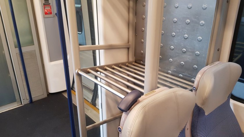 A fairly typically sized luggage rack on a British train
