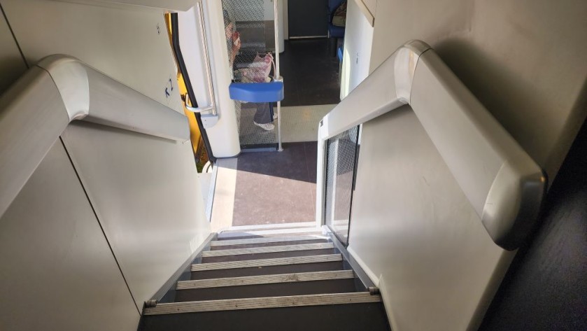 The stairs to the upper deck on a Dutch IC train