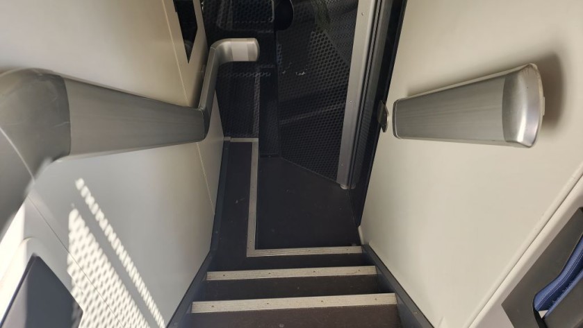 The stairs to the lower deck on a Dutch IC train