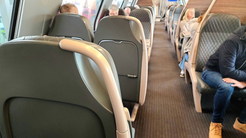 A 1st class upper deck seating saloon on a Belgian IC train