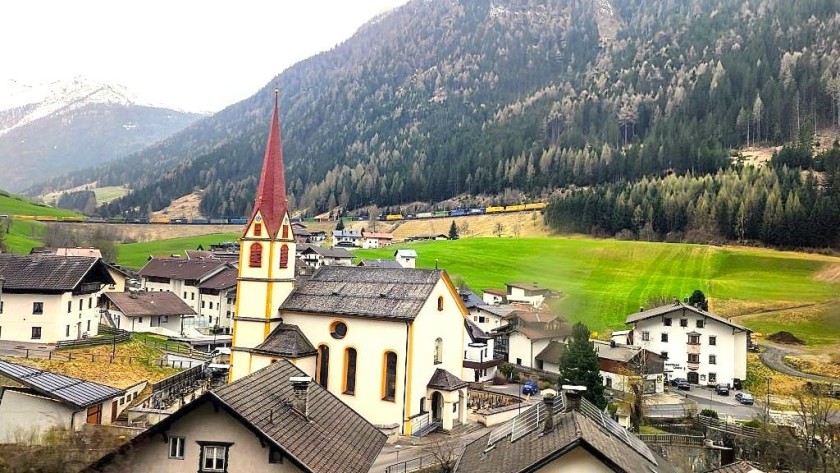 Travelling through the village of Sankt Jodok am Brenner and looking up the railway route to the south