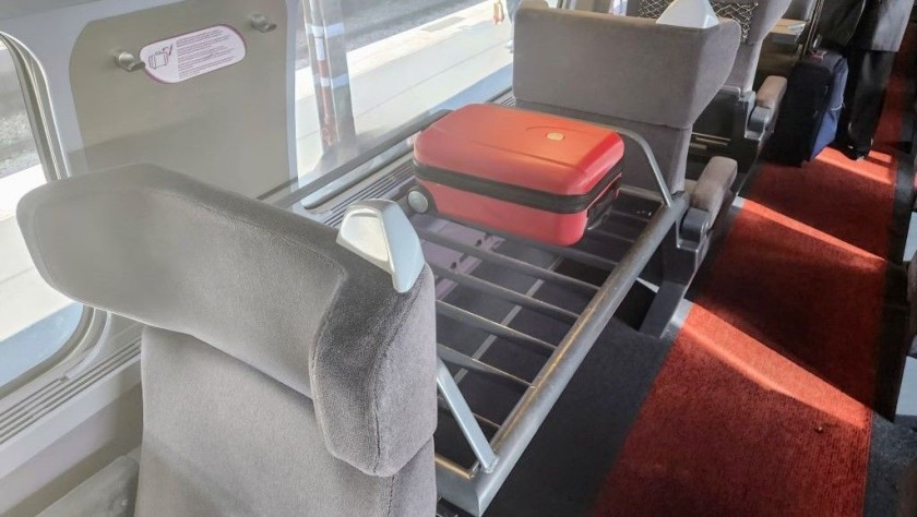 A luggage rack in Premiere Class on a Lyria service