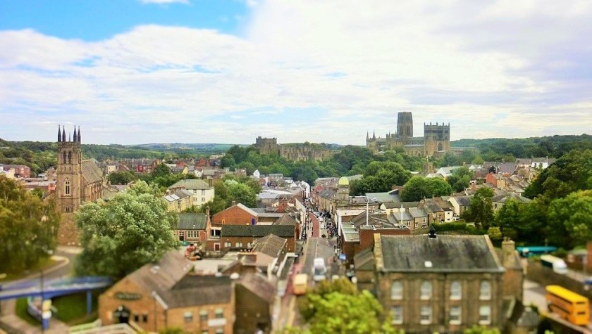 The castle and cathedral in Durham from a backwards facing seat to the north of Durham station