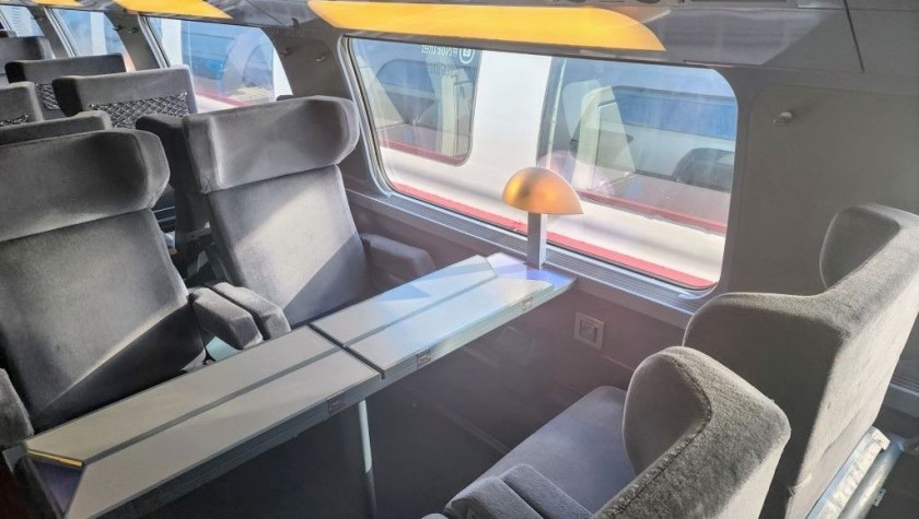 Premiere Class table seats on the upper deck of a Lyria train