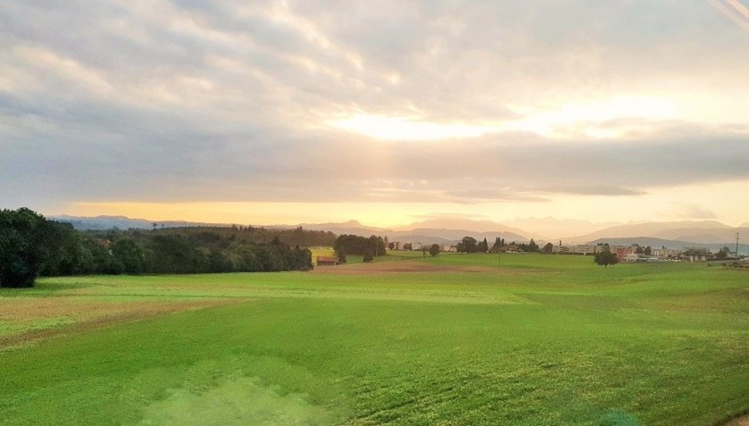 The sun sets over the Swiss countryside