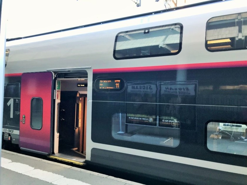 The coach number and destination info is the orange text beside the door