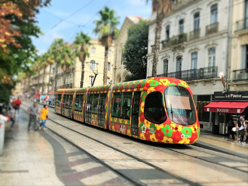 The tram stops are in the streets which fan off from the station