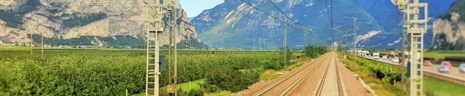 The view from the rear window as the train heads through the valley north of Trento