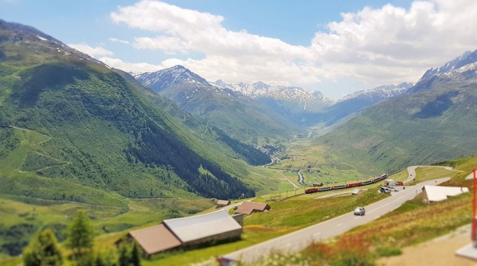 The Glacier Express train descends down the Oberalp Pass towards Andermatt