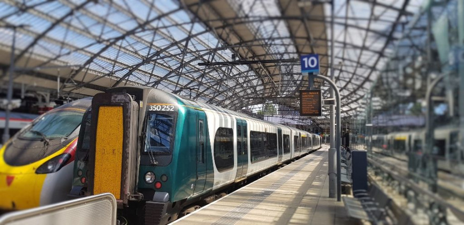 A Desiro train to the right of a Pendolino train 