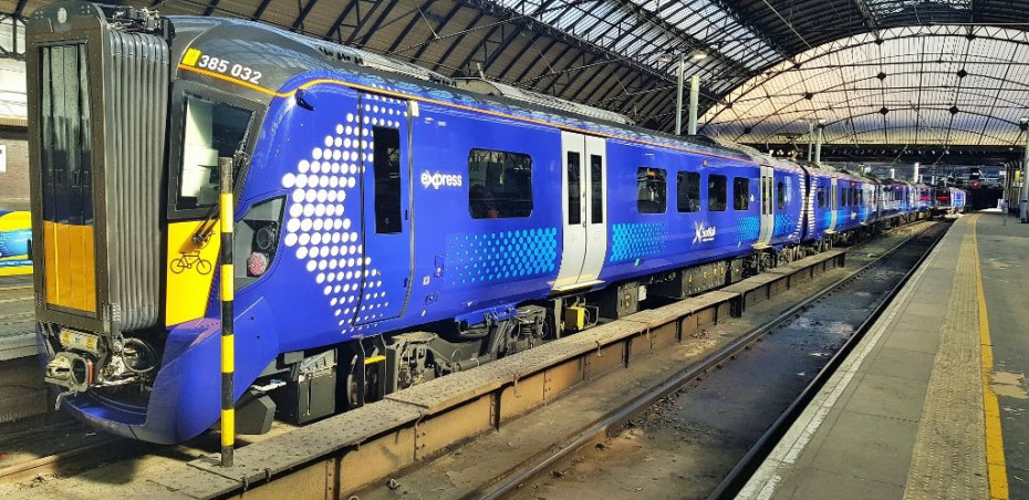 A train awaits departure from Glasgow - note the cycle symbol