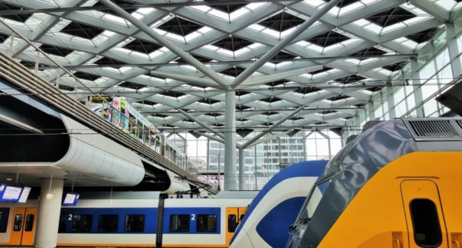 Trains meet tram at Den Haag Centraal