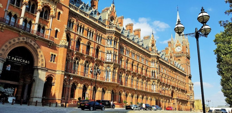 The magnificence of St Pancras station on Euston Road, the most romantic entrance is the arch by the red car