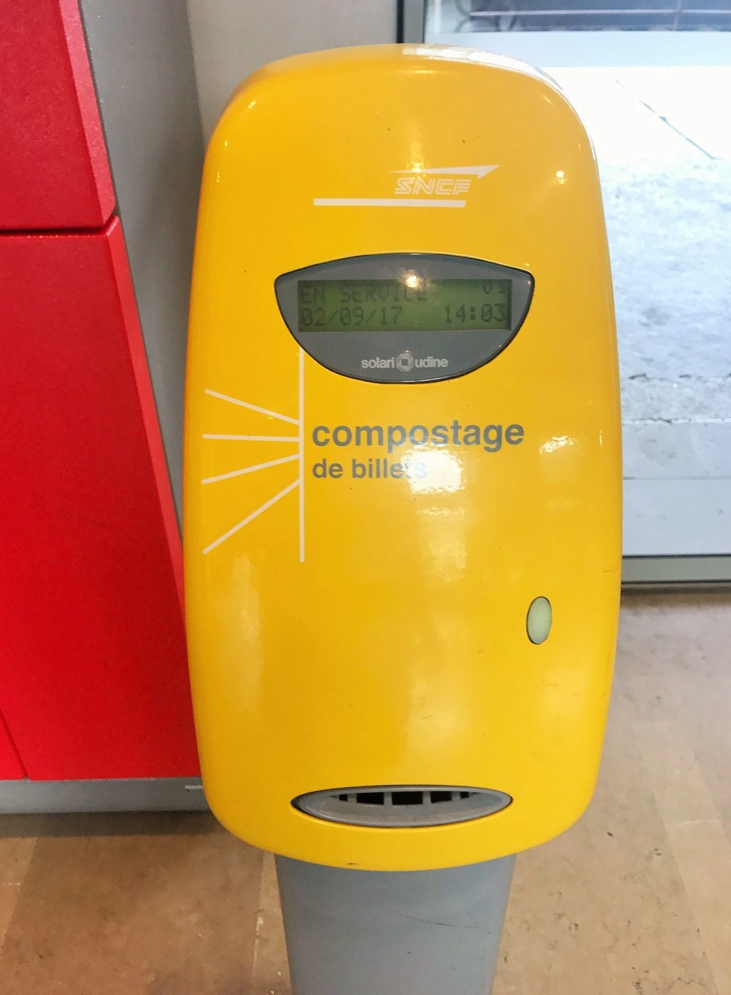 A SNCF ticket stamping machine
