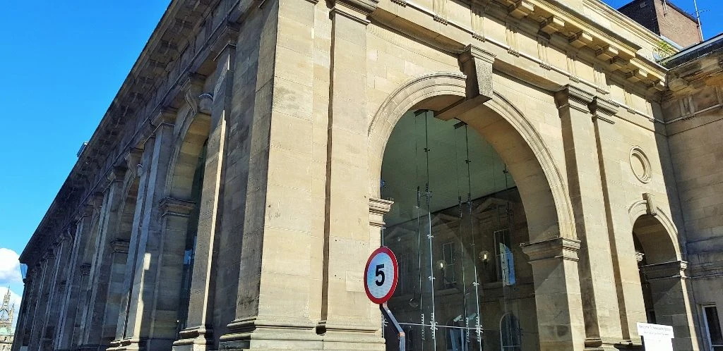 The sympathetically modernised portico on the exterior of Newcastle station