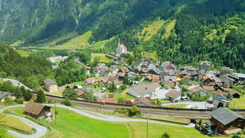 Looking down on the village of Wassen on day 6 of our scenic rail pass itinerary
