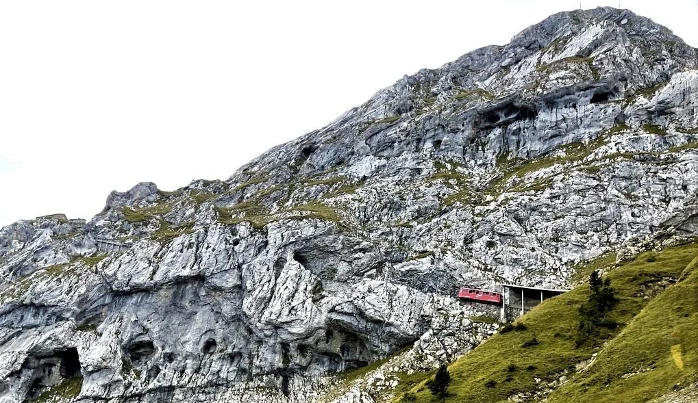 A train descends down Mt Pilatus on the world's steepest rack railway