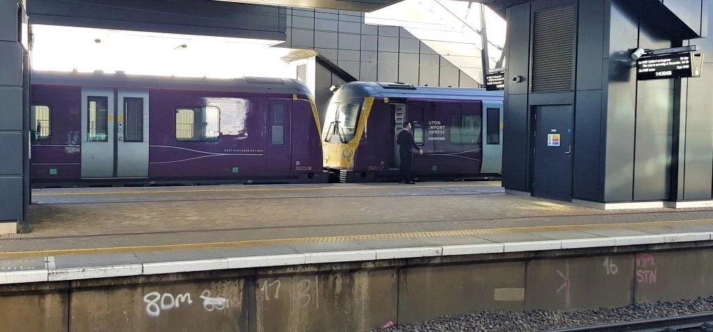 A Luton Airport Express train is calling at Luton Airport Parkway