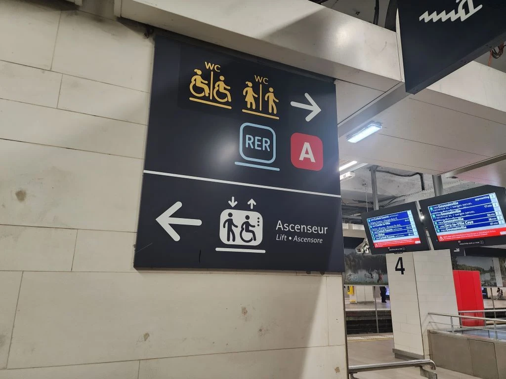 Seeking out the elevators at the RER station in the Gare Du Nord